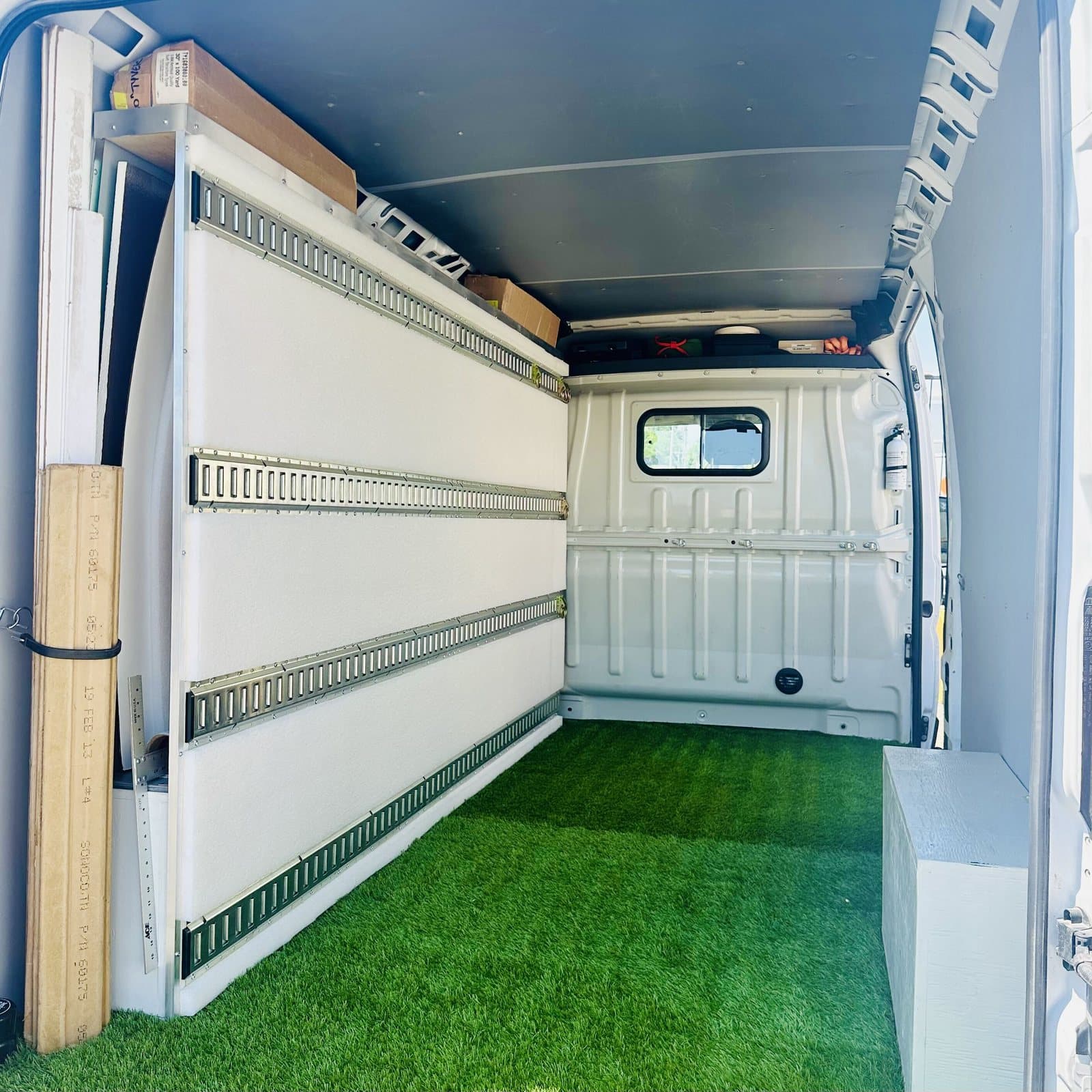 Inside an ArtVerb van with padded walls and a carpeted floor